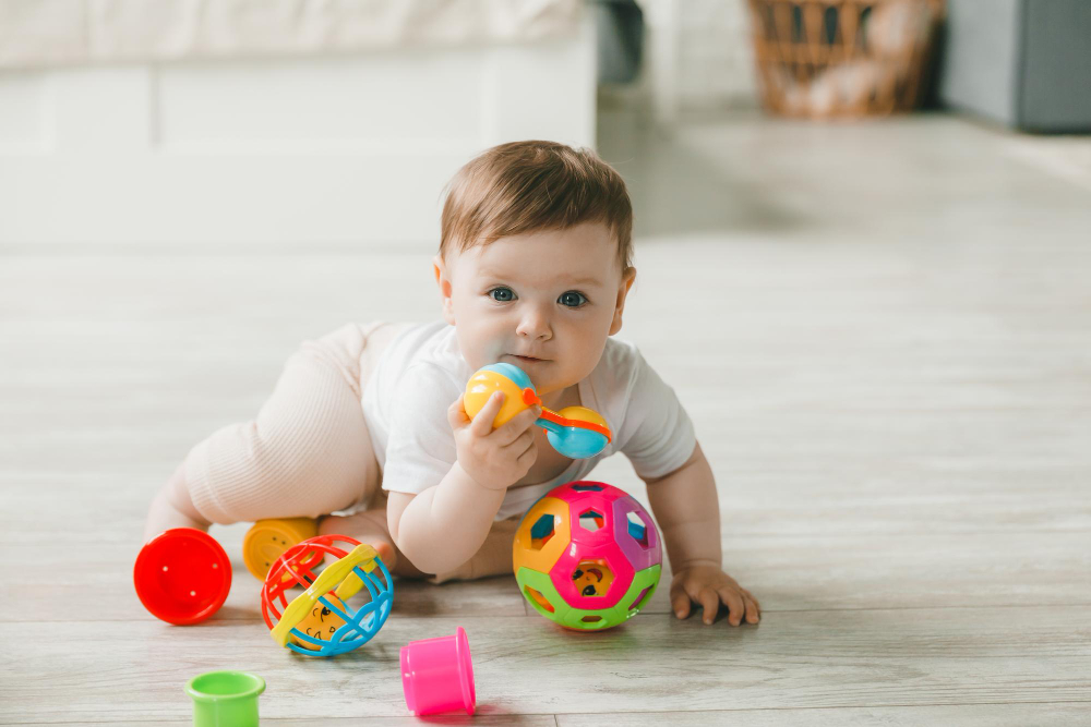 Baby playing with colorful educational toys
